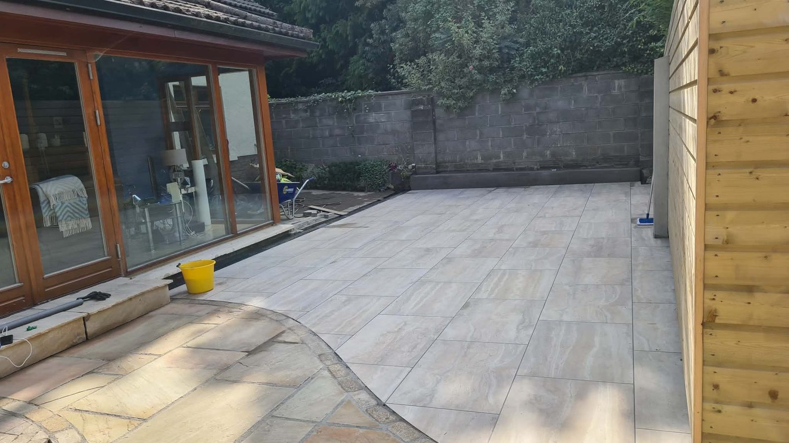 A patio part-way through being laid, tools still on site